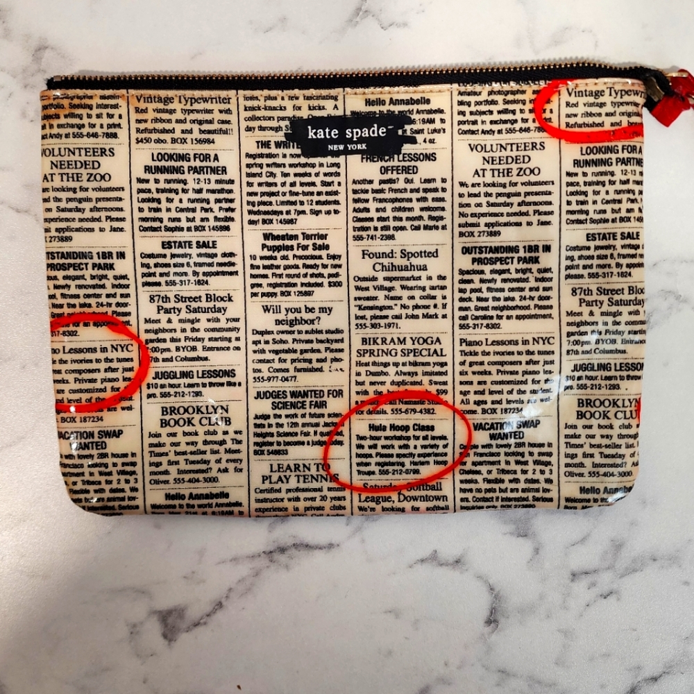 Kate Spade news print pouch.
